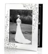 Etched with cascading florals, the silver-plated Trousseau photo album from Martha Stewart Collection presents wedding photos and other sentimental moments with fresh elegance. With velvet backing.