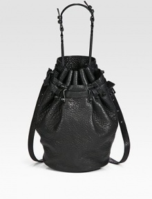 Gorgeous pebble-grain leather in a roomy drawstring bucket silhouette finished with chic matte hardware and dual strap options.Top handle, 8¼ dropDetachable adjustable crossbody strap, 14½-20¼ dropDrawstring closureOne outside open pocketProtective metal feetOne inside zip pocketTwo inner compartmentsFully lined11½W X 8H X 5DImported