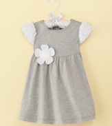 A flower for the little lady. Dainty floral details add girl power to this simple, stylish dress from First Impressions.