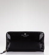 A simply chic continental wallet in glossy patent leather from kate spade new york.