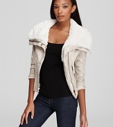 Right on trend for fall, the oh-so feminine, cropped silhouette of this uber-stylish GUESS jacket has arrived--fashioned with a lofty faux shearling collar and zipper details for warmth and modern edge.