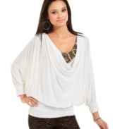 Pairing an embellished neckline with a billowy, draped bodice, Baby Phat delivers a top that makes major impact.