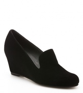 Smoking loafer looks on a sleek wedge heel define this Stuart Weitzman style.