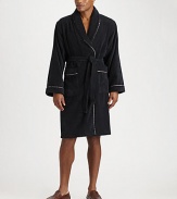 Plush cotton terrycloth offers renowned comfort before or after a shower, complete with a striped trim for a signature touch. Self belt and loops Patch pockets Calf length Pure cotton terrycloth Machine wash Imported 