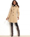 Kenneth Cole Reaction puts a contemporary spin on a classic silhouette. A nipped-in waist provides definition and feminine flair to this elegant topper.