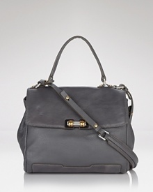 Explore ladylike territory with MARC BY MARC JACOBS top handle satchel. Roomy yet refined, this leather bag gives fall's loud prints and vibrant hues an urbane hit.