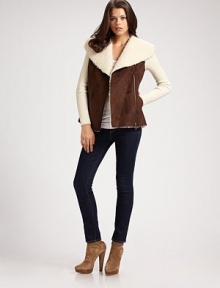 Faux suede surrounded by plush faux shearling and rib-knit sleeves. Polyester faux shearling collar Long ribbed sleeves Asymmetrical front zipper Ribbed hem 80% acrylic/20% polyester faux fur lining About 27 from natural waist 50% acrylic/30% wool/20% nylon Hand wash Imported