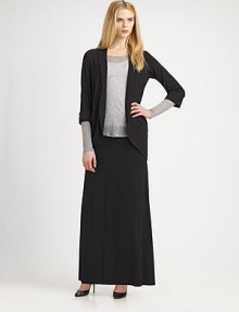 The perfect balance between relaxed and tailored style featuring convenient front pockets. Shawl collarThree-quarter sleevesFront pocketsCurved hemAbout 28 from shoulder to hem93% viscose/7% spandexMachine washImported Model shown is 5'11 (180cm) wearing US size Small. 