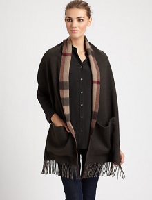Reverses from solid to a bold check pattern with fringe trim on luxurious cashmere.Cashmere74 X 15Dry cleanImported