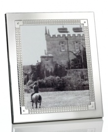 Engraved for timeless style in stainless steel and silver plate, the Watchband picture frame from Lauren Ralph Lauren is a sleek accessory for polished decor. Engraved for timeless style in stainless steel and silver plate, the Watchband picture frame from Lauren Ralph Lauren is a sleek accessory for polished decor.