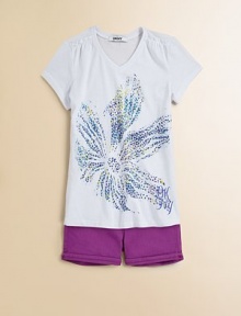 A colorful, splattered flower screen adds a splash of color to this cozy knit.V-neckShort sleevesPullover styleShoulder ruffles60% cotton/40% polyesterMachine washImported