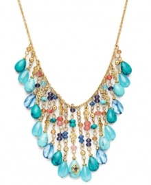 Splash your neckline with summery hues. Lauren by Ralph Lauren's perfects any warm-weather ensemble with semi-precious reconstituted turquoise and coral-hued glass accents. Set in gold tone mixed metal with a lobster claw closure. Approximate length: 16 inches + 2-inch extender. Approximate drop: 3/4 inch to 2-1/4 inches. Splash your neckline with summery hues. Lauren by Ralph Lauren's perfects any warm-weather ensemble with semi-precious reconstituted turquoise and coral-hued glass accents. Set in gold tone mixed metal with a lobster claw closure. Approximate length: 16 inches + 2-inch extender. Approximate drop: 3/4 inch to 2-1/4 inches.