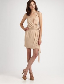 Sexy and sleek, in softly knit jersey accented with an attached self sash at the waist.Surplice halter necklineWrap frontSelf waist tieLow backAbout 18¼ from natural waistRayonDry cleanImportedModel shown is 5'9 (175cm) wearing US size Small. 