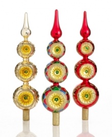 A reflection of holiday joy, this Christmas tree topper from Kurt Adler features three stacked ball ornaments capped with a simple finial. Brilliant color and gold glitter put any tree over the top. A reflection of holiday joy, this Christmas tree topper from Kurt Adler features three stacked ball ornaments capped with a simple finial. Brilliant color and gold glitter put any tree over the top.