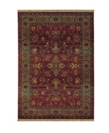 A truly charming interpretation of a traditional carpet, this rug features a center medallion ringed by palmettes and floral details in sage green, topaz and slate blue against a rich burgundy ground. Striated effects create the weathered look of handmade rugs in a stain-resistant, no-shed manmade fiber. A truly charming interpretation of a traditional carpet, this rug features a center medallion ringed by palmettes and floral details in sage green, topaz and slate blue against a rich burgundy ground. Striated effects create the weathered look of handmade rugs in a stain-resistant, no-shed manmade fiber.
