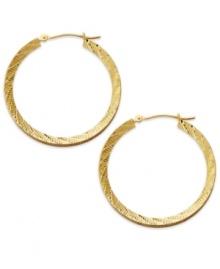 Lovely and luxe, these 14k gold wheat hoops complement any look. Each diamond-cut earring secures with a lever backing. Approximate diameter: 1-1/4 inches. Lovely and luxe, these 14k gold wheat hoops complement any look. Each diamond-cut earring secures with a lever backing. Approximate diameter: 1-1/4 inches.