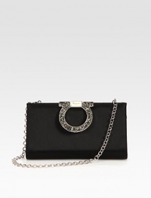 An elegant and versatile design in smooth satin embellished with an oversized, rhinestone accented logo closure.Detachable chain shoulder strap, 9½ dropHinged, fold-over top closureOne inside open pocketQuilted satin lining8W X 4½H X 1½DMade in Italy