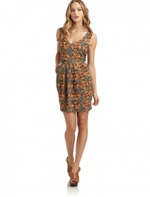 THE LOOKAllover tribal printPleated skirtDual besom pocketsBack cutout with tie closureBack zip closureTHE FITAbout 30 from shoulder to hemTHE MATERIALRayonCARE & ORIGINDry cleanMade in USAModel shown is 5'11 (180cm) wearing US size Small. 