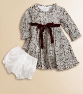Blooming with a vivid floral print and a velvet tie, this delightful cotton frock with matching bloomers will make your little one feel like a flower girl.Ruffled round necklineLong sleevesBack buttonsWaistband with velvet ribbon tieFull skirtFully linedCottonMachine washImported Please note: Number of buttons may vary depending on size ordered. 