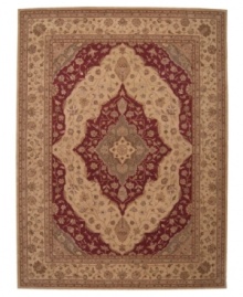 A dynamic mix of alternating beige and red tones gives this rug its fascinating charm. Carefully handcrafted of hard-twist wool yarns, this gorgeous piece offers exceptional softness and a markedly dense texture.