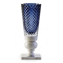 Designed by Marcel Wanders, Baccarat's Kings of the Forest vase was inspired by nature and the Dutch art of lace making. Combining various materials and patterns, it features diamond-cut crystal atop a marble base.