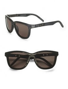 Modern, retro shaped acetate frames with contrast zipper trim and zipper pull temple detail. Available in matte black with nickel zipper and dark grey lens. Acetate/beryllium copper UV 400 lens Imported 