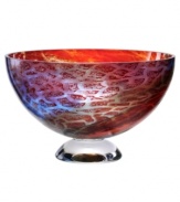 An expression of Africa's rich savannah, the Zanzibar bowl unites bright fiery reds and cool sky blues in an abstract maze of color and texture. Its globular shape, crafted in heavy art glass, is a tribute to Earth. By Scandinavian artist Kjell Engman.