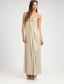 This dazzling, flowy design features an alluringly low-draped back and a jeweled cutout detail at the bust.Strapless necklineJeweled cutout detailRuched bustGathered frontLow draped back with gathered back panel strapAbout 44 from natural waist91% polyester/9% spandexHand washMade in USA of imported fabric This dazzling, flowy design features an alluringly low-draped back and a jeweled cutout detail at the bust.Strapless necklineJeweled cutout detailRuched bustGathered frontLow draped back with gathered back panel strapAbout 44 from natural waist91% polyester/9% spandexHand washMade in USA of imported fabric