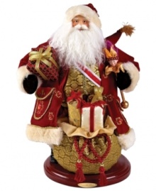 A richly ornamented version of the season's merriest symbol, Santa Claus is draped in lavish gold and burgundy wares in this heirloom figurine from Christopher Radko. A richly ornamented version of the season's merriest symbol, Santa Claus is draped in lavish gold and burgundy wares in this heirloom figurine from Christopher Radko.