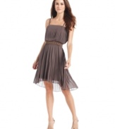 Nine West's dress balances a flirty femme feel with a dose of daring thanks to its blouson-style bodice, pretty pleating and edgy studded waistband.
