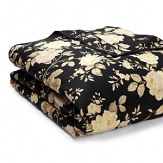 Silhouetted blossoms cascade across a bold black ground with hints of sage, pale yellow and rose on duvets, comforters and shams in this classic bedding collection.