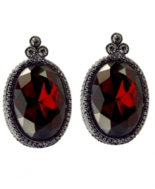 Antique allure. Vintage inspiration defines T Tahari's Crystal Elegance Collection faceted ruby crystal button clip on earrings. Accented by glittering black crystals, they're crafted in hematite tone mixed metal and nickel free for sensitive skin. Approximate size: 1-1/2 inches x 3/4 inch.