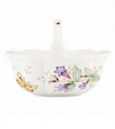 Spring is perpetually in season with the whimsical Butterfly Meadow basket from Lenox. A handled design with colorful blooms and butterflies in scalloped white porcelain lends country charm to any setting. Qualifies for Rebate