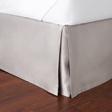 The dobby stripes in shades of taupe and vanilla bordered by raised satin on this Hudson Park queen bedskirt evoke modern simplicity and timeless sophistication.
