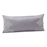 An enchanting, traditional pattern in silver embroidered on lilac frames this decorative pillow. Coordinates with duvet and shams.