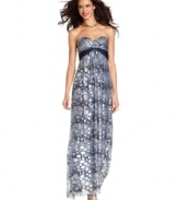 Metallic touches add a shot of shine to this printed maxi from BCBGMAXAZRIA. Show off the strapless silhouette with a luxe necklace!