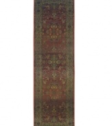 This long runner is ideal for hallways and entryways. A truly charming interpretation of a traditional carpet, this rug features a center medallion ringed by palmettes and floral details in sage green, topaz and slate blue against a rich burgundy ground. Striated effects create the weathered look of handmade rugs in a stain-resistant, no-shed manmade fiber.