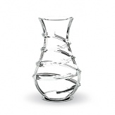 Designed by Thomas Bastide, this elegant Baccarat Carnaval vase will have people stepping right up to see its twirling, spiral design. A narrow neck makes it ideal for arranging flowers.