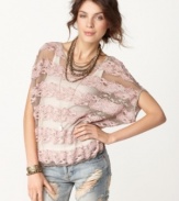 Free People's casual top takes you from day to night with sophisticated lace. Pair it with a cami and destroyed jeans for a trend-forward ensemble.