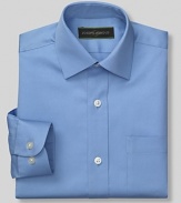 Classic dress shirt with spread collar and two pockets. Button front closure. Made with a little stretch that will move with him and retain its shape after washing.