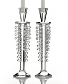 Candlestick meets chandelier in glamorous Barcelona candle holders from Lighting by Design. Glistening beads dangle between the light above and faceted base below for a pair with old-world grandeur. Candlestick meets chandelier in glamorous Barcelona candle holders from Lighting by Design. Glistening beads dangle between the light above and faceted base below for a pair with old-world grandeur.
