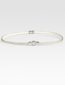 Linen meets leather, giving this adjustable skinny belt, a hint of bohemian flair. About .5 wideLeatherImported
