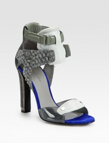 Multi-tone leather, patent leather and uniquely textured suede design with a duo of wrap-around ankle straps. Self-covered heel, 4 (100mm)Patent leather, suede and leather upperLeather lining and solePadded insoleImported
