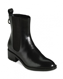 These Chelsea-style Cole Haan booties feature oversized pull tabs and stretch sides that make this waterproof design easy to pull on. They're rain boots, incognito-perfect for work. These Chelsea-style Cole Haan booties feature oversized pull tabs and stretch sides that make this waterproof design easy to pull on. They're rain boots, incognito-perfect for work.
