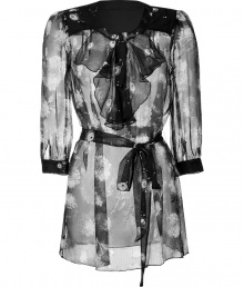 Luxe top in fine, pure black printed silk - Sheer, featherweight fabric drapes beautifully - Elegant, all-over white floral motif is quintessentially Anna Sui - Round neck with decorative ruffle embellishment - On-trend, 3/4 sleeves and belted tie waist - Darker trim at cuffs and shoulders - Feminine and fluid, easily goes from work to weekend - Pair with flared trousers, leather pants or skinny denim