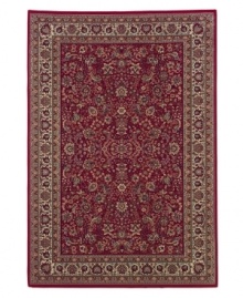 Inspired by the lovely Sarouk carpets of ancient Persia, this rug features an intricate floral motif in ivory, sage green and accents of soft blue against a rich red ground. Inspired by the lovely Sarouk carpets of ancient Persia, this rug features an intricate floral motif in ivory, sage green and accents of soft blue against a rich red ground.