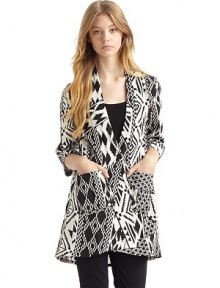 THE LOOKExotic, geometric pattern throughoutDeep V necklineButton frontElbow-length sleeves with turn-back cuffsDual patch pockets at frontTHE FITAbout 28½ from shoulder to hemTHE MATERIALSilkCARE & ORIGINDry cleanImportedOUR FIT MODEL RECOMMENDS ordering one size up as this style runs small. THE LOOKExotic, geometric pattern throughoutDeep V necklineButton frontElbow-length sleeves with turn-back cuffsDual patch pockets at frontTHE FITAbout 28½ from shoulder to hemTHE MATERIALSilkCARE & ORIGINDry cleanImportedOUR FIT MODEL RECOMMENDS ordering one size up as this style runs small.