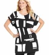 An abstract print electrifies Alfani's short sleeve plus size tunic top-- complete the look with leggings.
