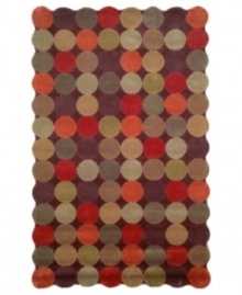 A series of colorful circles stand side-by-side to create a striking field of reds, maroons and greens. This room-changing rug features a unique, wavy edge, comprised of the collective curves of the outer circles, bringing a modern touch to any room in your home. A series of colorful circles stand side-by-side to create a striking field of reds, maroons and greens. This room-changing rug features a unique, wavy edge, comprised of the collective curves of the outer circles, bringing a modern touch to any room in your home.