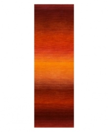 Imparting warm visions of brilliant sunrises on the horizon, this deeply textured rug features intense tones of red and orange that recall a perfect morning sky. Hand-tufted and color blended with the greatest of care, this wool rug comes alive with texture and color. Imparting warm visions of brilliant sunrises on the horizon, this deeply textured rug features intense tones of red and orange that recall a perfect morning sky. Hand-tufted and color blended with the greatest of care, this wool rug comes alive with texture and color.